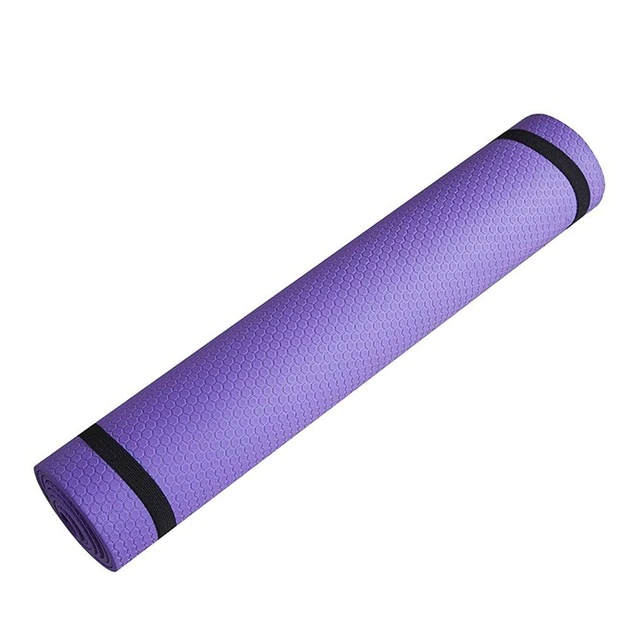 Premium Photo  Rolled purple yoga mat and clear plastic water bottle on a  wooden surface with natural light genderneutral fitness yoga and exercise  props at home or gym banner with copy